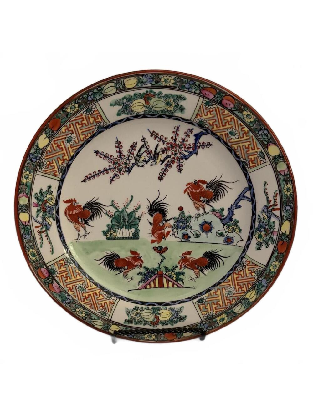 A vintage Chinese export porcelain plate in Famille Rose style.